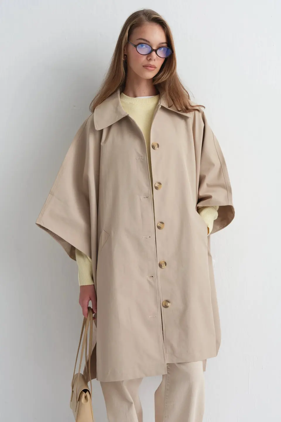 Poncho met knoopsluiting