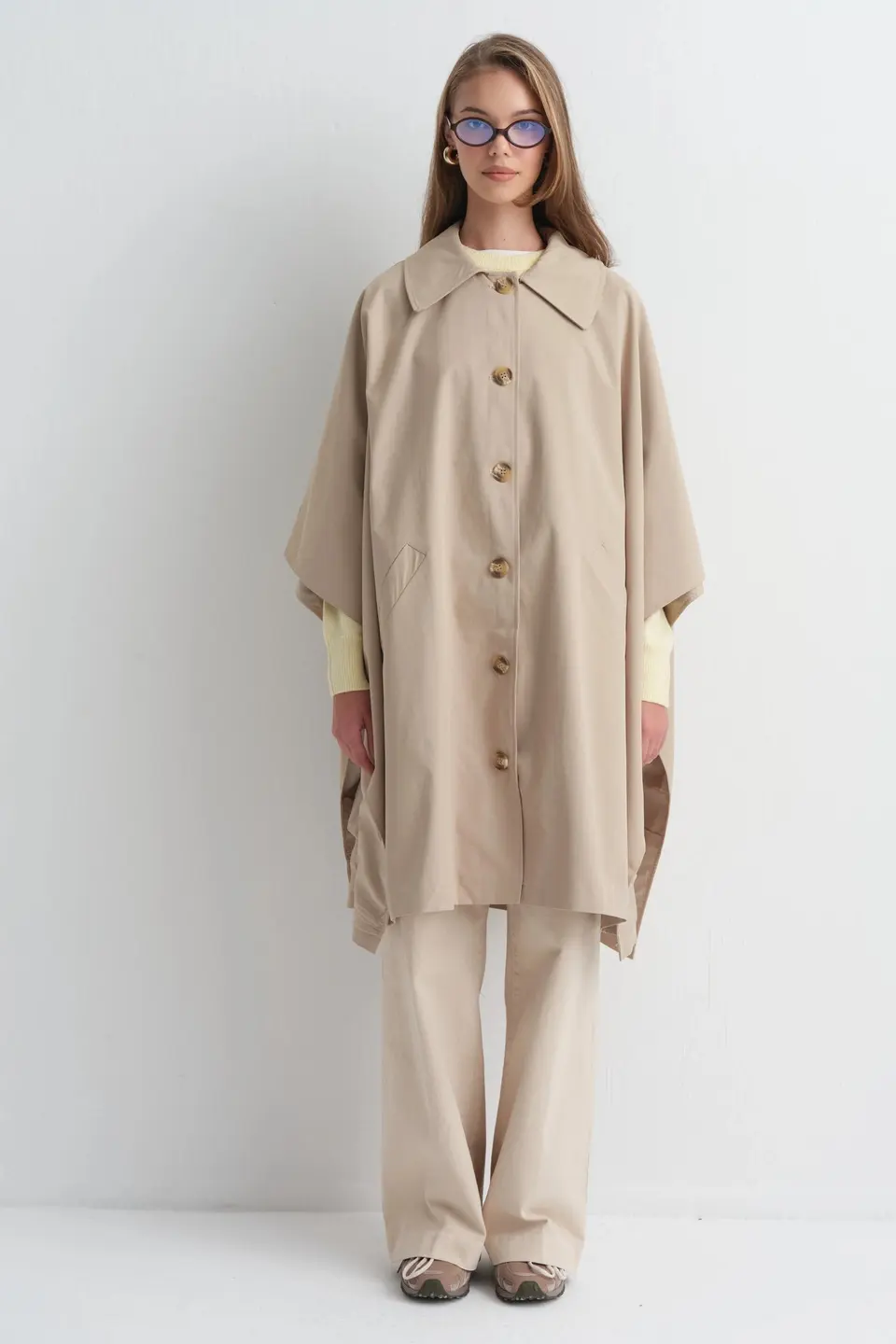 Poncho met knoopsluiting