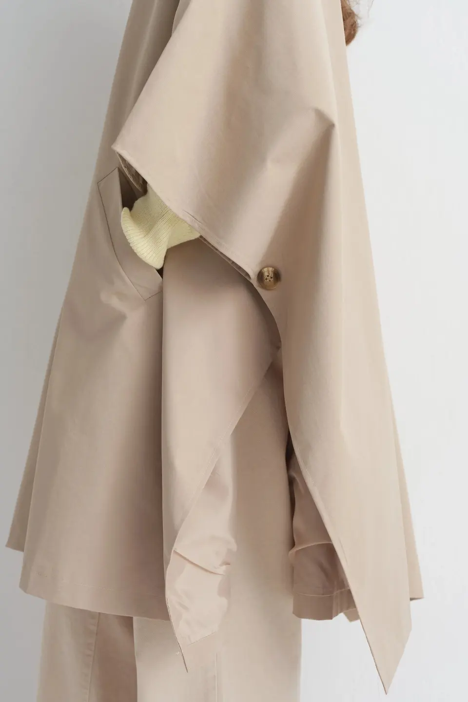 Poncho met knoopsluiting