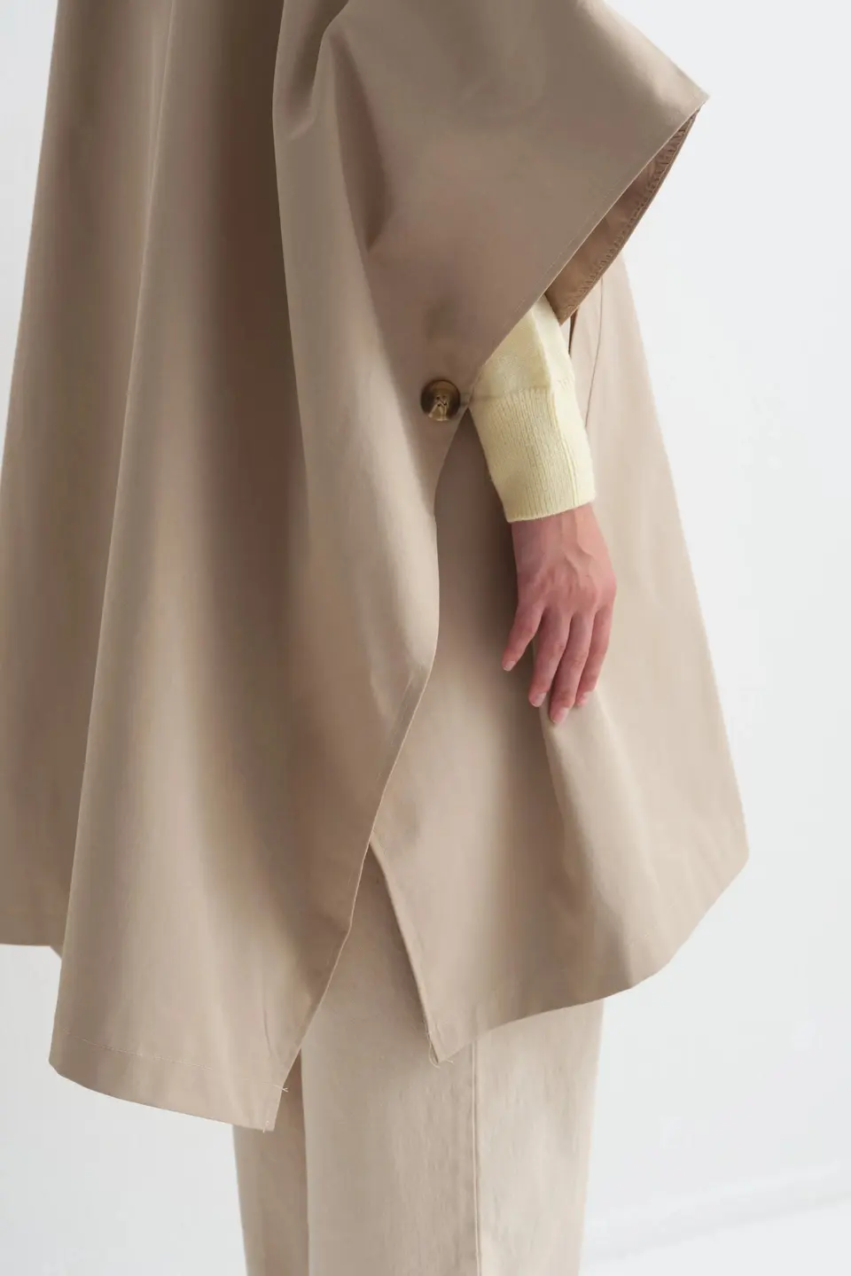 Poncho met knoopsluiting