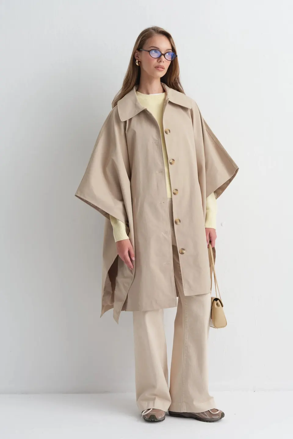 Poncho met knoopsluiting